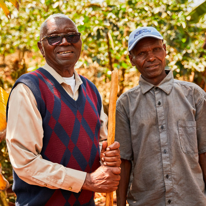 Peter and coffee factory manager Francis Maura.
